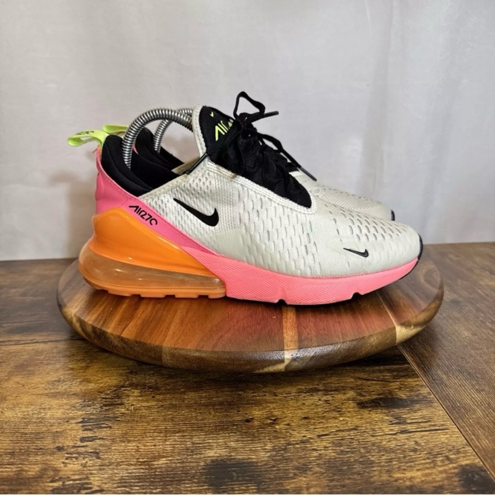 Pink, orange, and white Nike shoes